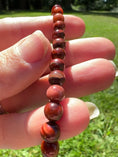 Load and play video in Gallery viewer, Red Tigers Eye Crystal Bracelet
